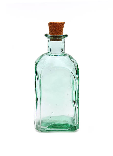 istock Old cork stoppered green glass bottle 472211312
