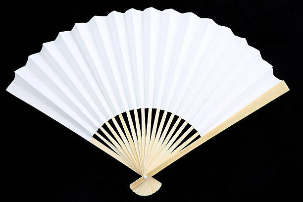 White Chinese Folding Fan White Chinese Folding Fan on Black Background folding fan stock pictures, royalty-free photos & images