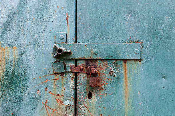 istock old  rusty lock on the metal blue gate 472211476