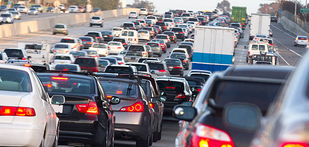 Traffic Jam A traffic jam on the 5 freeway heading south in Orange County California. queuing stock pictures, royalty-free photos & images