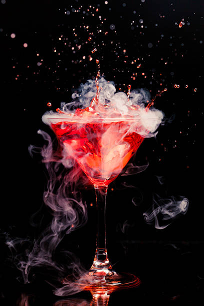 istock red cocktail with splash and ice vapor 472213519
