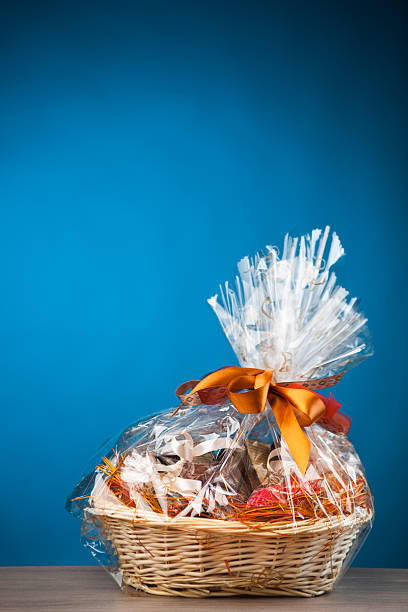 istock Gift basket of presents wrapped in cellophane 472213629