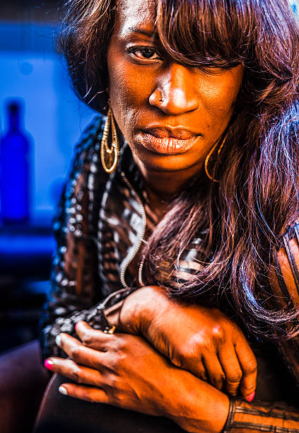 istock Mature black woman drink coctail 472213649