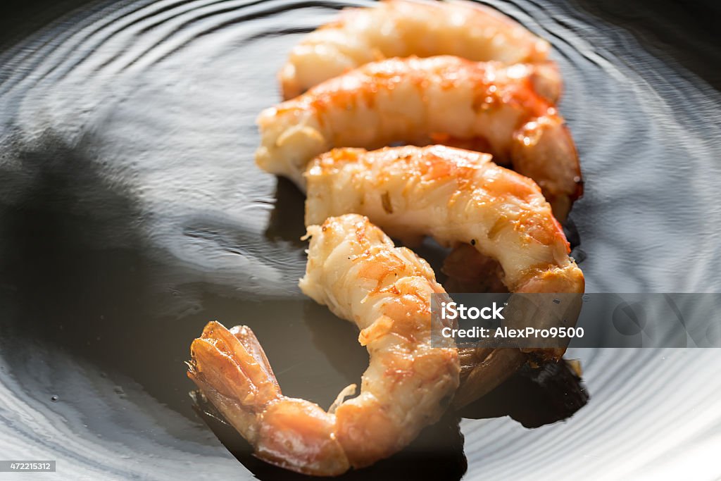 Fried shrimps on the black background 2015 Stock Photo