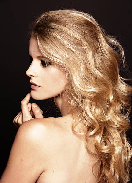 istock young pretty model with curly blond hair 472215600