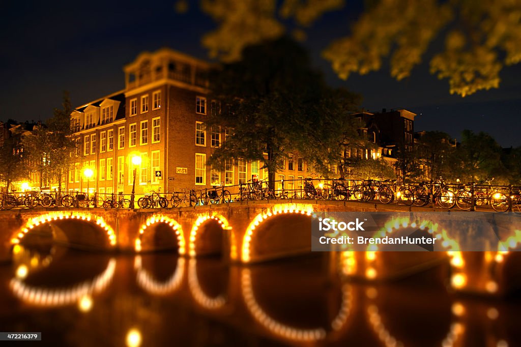 Corner of Bridges A swift moving canal in Amsterdam. Amsterdam Stock Photo