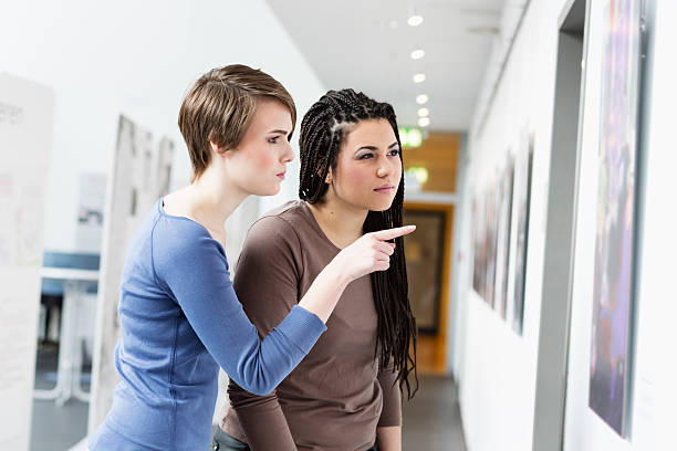 istock young women visiting exhibition 472216889
