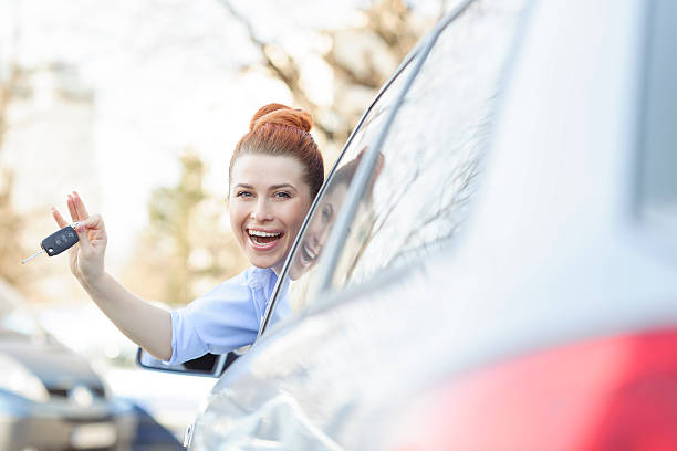 istock happy driver woman 472217483