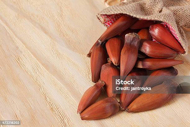 Pinhao Brazilian Pine From Sackcloth Bag On Wooden Table Stock Photo - Download Image Now