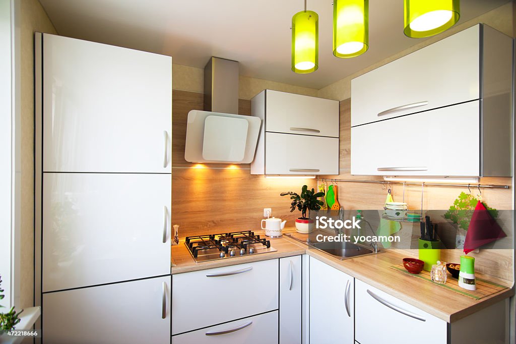 White and brown interior for small kitchen White and brown interior for small kitchen with green elements Kitchen Stock Photo