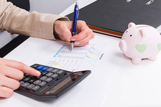 istock Women calculate expenses 472219951