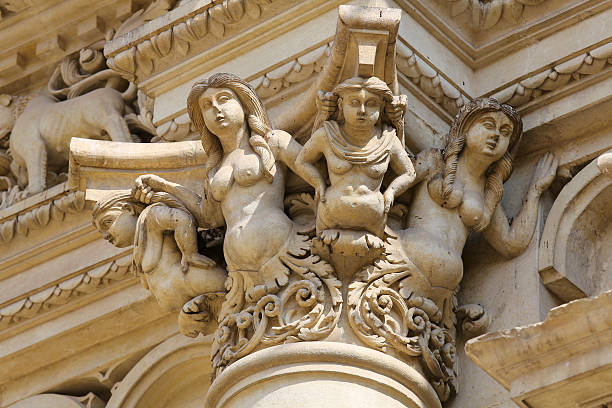 Statues at the Santa Croce baroque church in Lecce Statues at the Basilica of Santa Croce or Church of the Holy Cross, a famous baroque church in Lecce, Apulia, Southern Italy. piazza di santa croce stock pictures, royalty-free photos & images