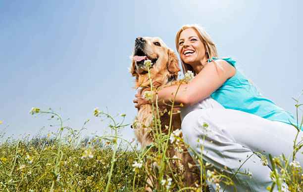 istock Woman with a golden retriever. 472220995