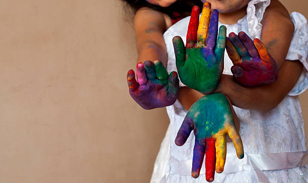 istock Two girls playing with colors 472221039