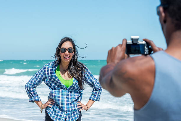 istock Diverse Couple Taking Pictures on Vero Beach 472221599