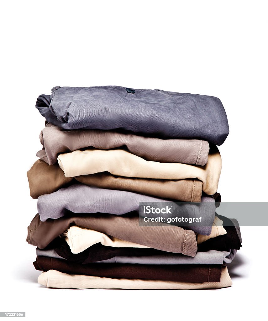 Folded Old Blue Jeans Isolated on a white. Clipping path included. Pants Stock Photo