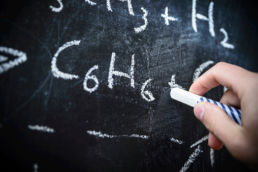 Drawing a chemical formula onto a blackboard