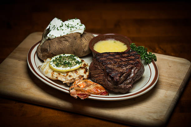 explore & turf - surf and turf prepared shrimp steak grilled fotografías e imágenes de stock