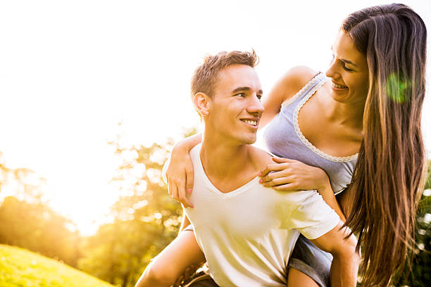 istock Couple piggybacking at sunset. 472225465