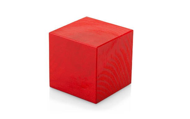 Red wooden cube toy isolated on white background