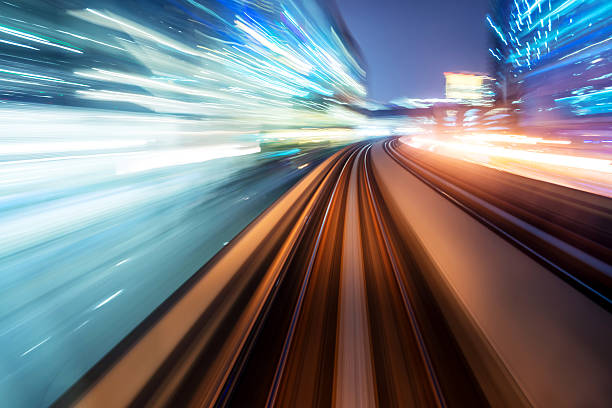 istock traffic car light stream at night in the city 472230611