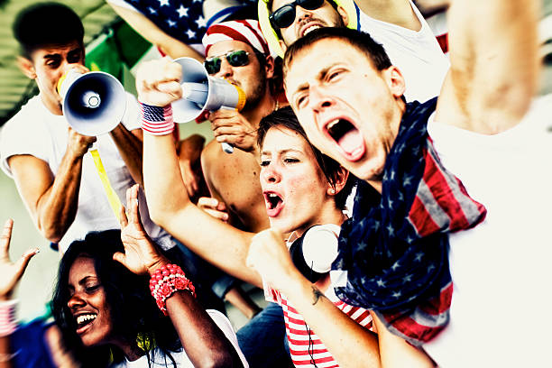 istock Sports fans cheering a game 472230923