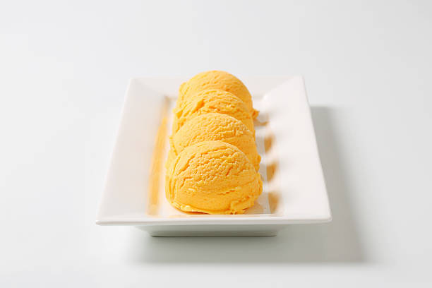istock Scoops of apricot ice cream 472231527