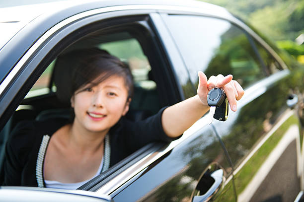 istock young woman with keys 472231623