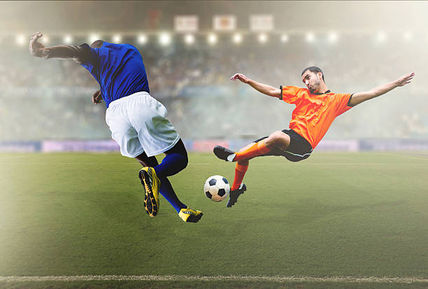 istock Football players at the stadium 472232043