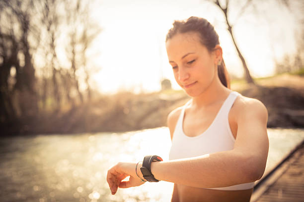 istock Young woman jogging 472232303