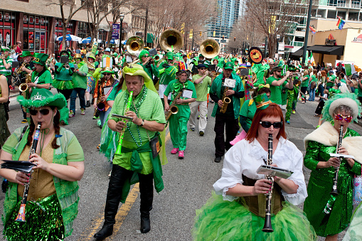 Atlanta, GA, USA - March 15, 2014:  A band dressed in eclectic green costumes plays while marching in the St. Patrick's parade down Peachtree Street.