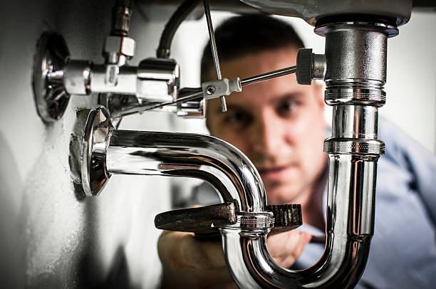 istock Plumber repairing sink 472233179
