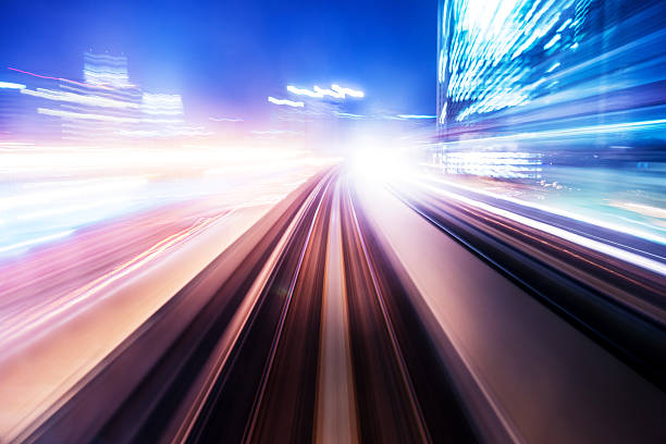 istock traffic car light stream at night in the city 472233901