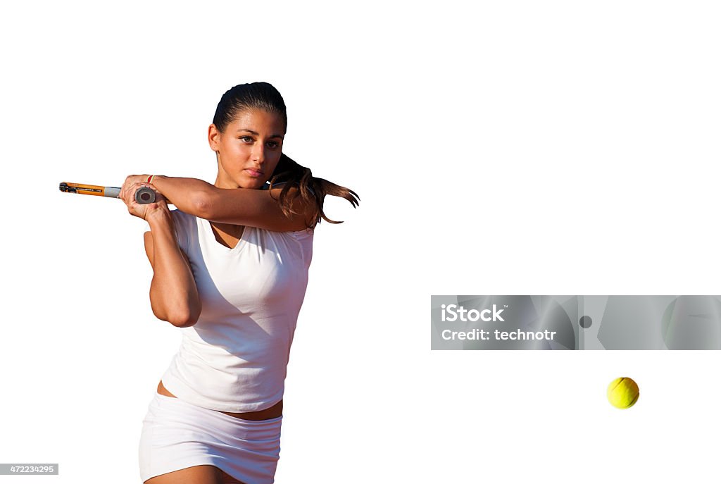 Beautiful young woman playing tennis Front view of female tennis player at backhand,  two hand backhand grip,  selective focus, isolated Cut Out Stock Photo
