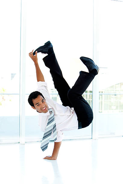 istock Young businessman showing off 472234475