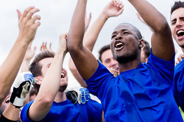 istock Football team celebrating a goal 472234827