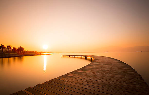 Pier Crescent-shaped pier at sunrise... cleveland england stock pictures, royalty-free photos & images