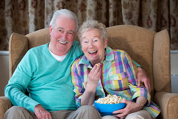 istock Senior Couple Watching a Movie 472236623