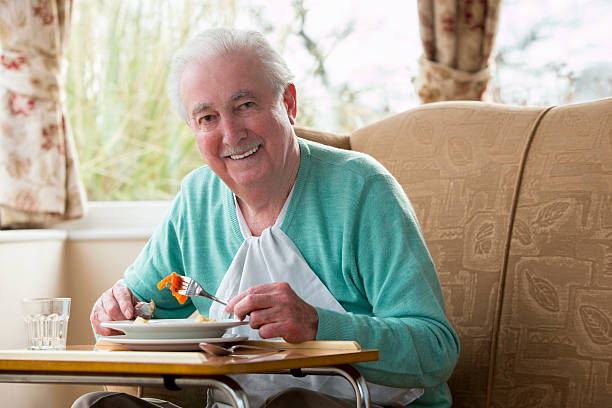 istock Senior Man Enjoying his Lunch 472236639