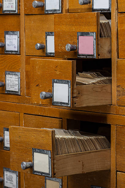 istock Old wooden card catalog with  opened drawer 472237056