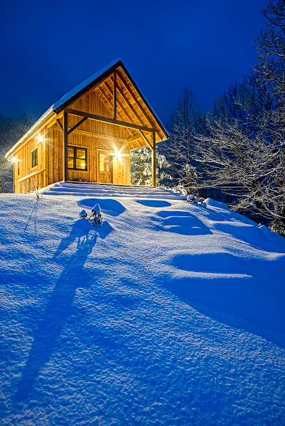 istock A rustic cabin on top of a snowy mountain 472237481