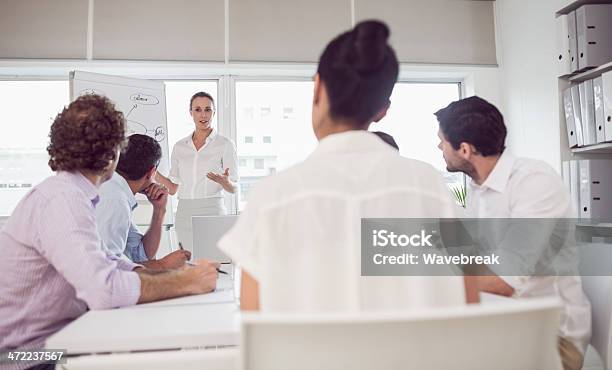 Business People In Office At Presentation Stock Photo - Download Image Now - 25-29 Years, 30-39 Years, 35-39 Years