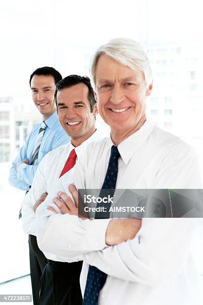 Ceo With Managers Stock Photo - Download Image Now - Bank Manager, Standing, 30-39 Years