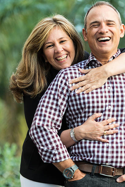 istock mature couple laughing 472238615