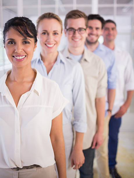 istock Confident happy business team standing in row 472238949