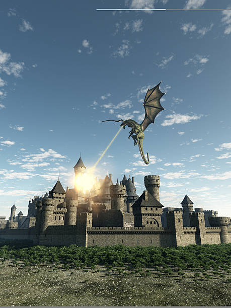 Dragon atacar uma cidade Medieval murada - foto de acervo