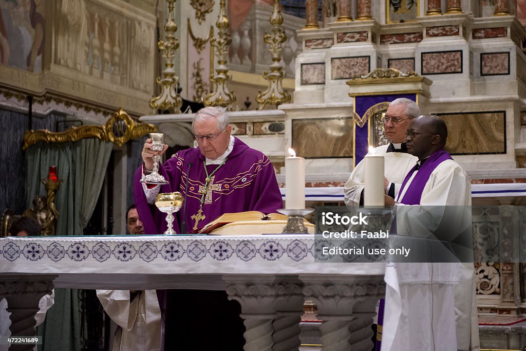 Bishop officiating Communion Genoa, Italy - March 22, 2014 : Bishop and priest officiating Mass for confirmation in the Church of Santa Maria dell'Assunta in Sestri Ponente - Genoa Altar Stock Photo