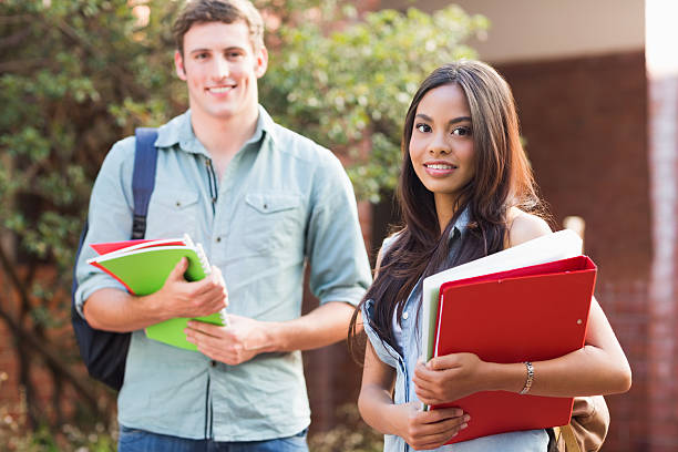 istock Female student with friend at college campus 472242401