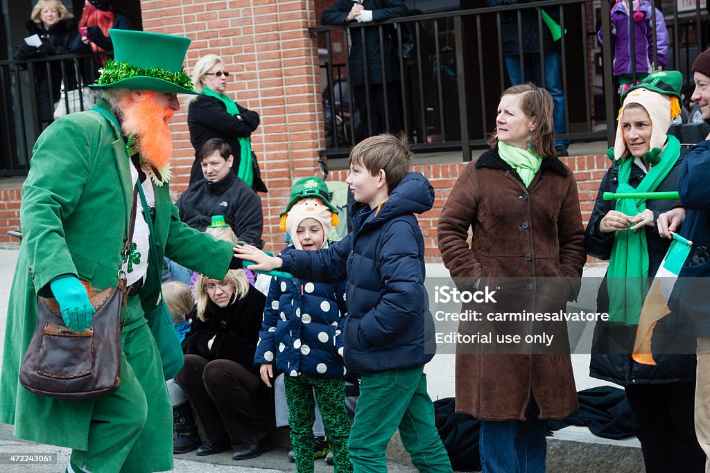 spectators Greenwich, CT, USA - March 23, 2014: People from Greenwich and of surrounding towns are enjoying the annual "St. Patrick's Day Parade". The parade consists of over forty groups including clowns, dancers, bagpipe bands, local school marching bands, fire department and police department along with local politicians St. Patrick's Day Stock Photo