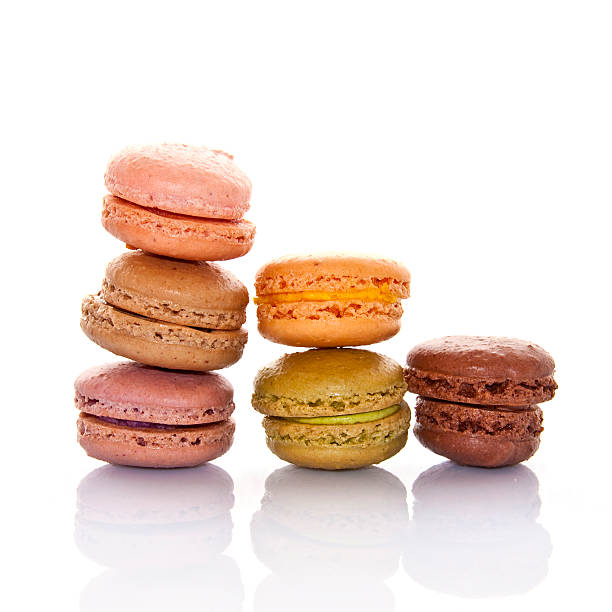 istock Pyramid of pastel colored french macarons, on white background 472246716
